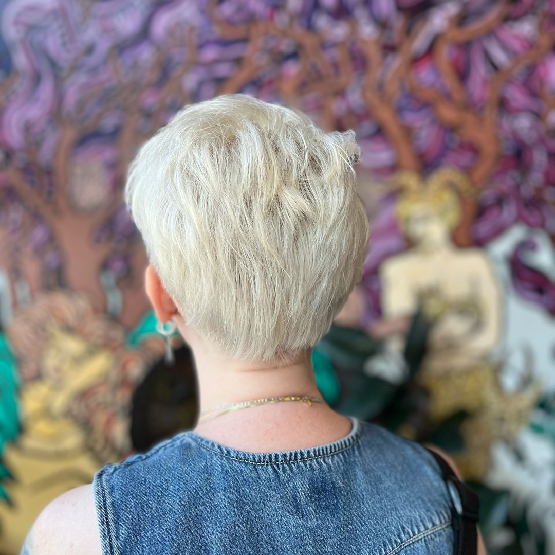 platinum blonde pixie cut with shaved sides