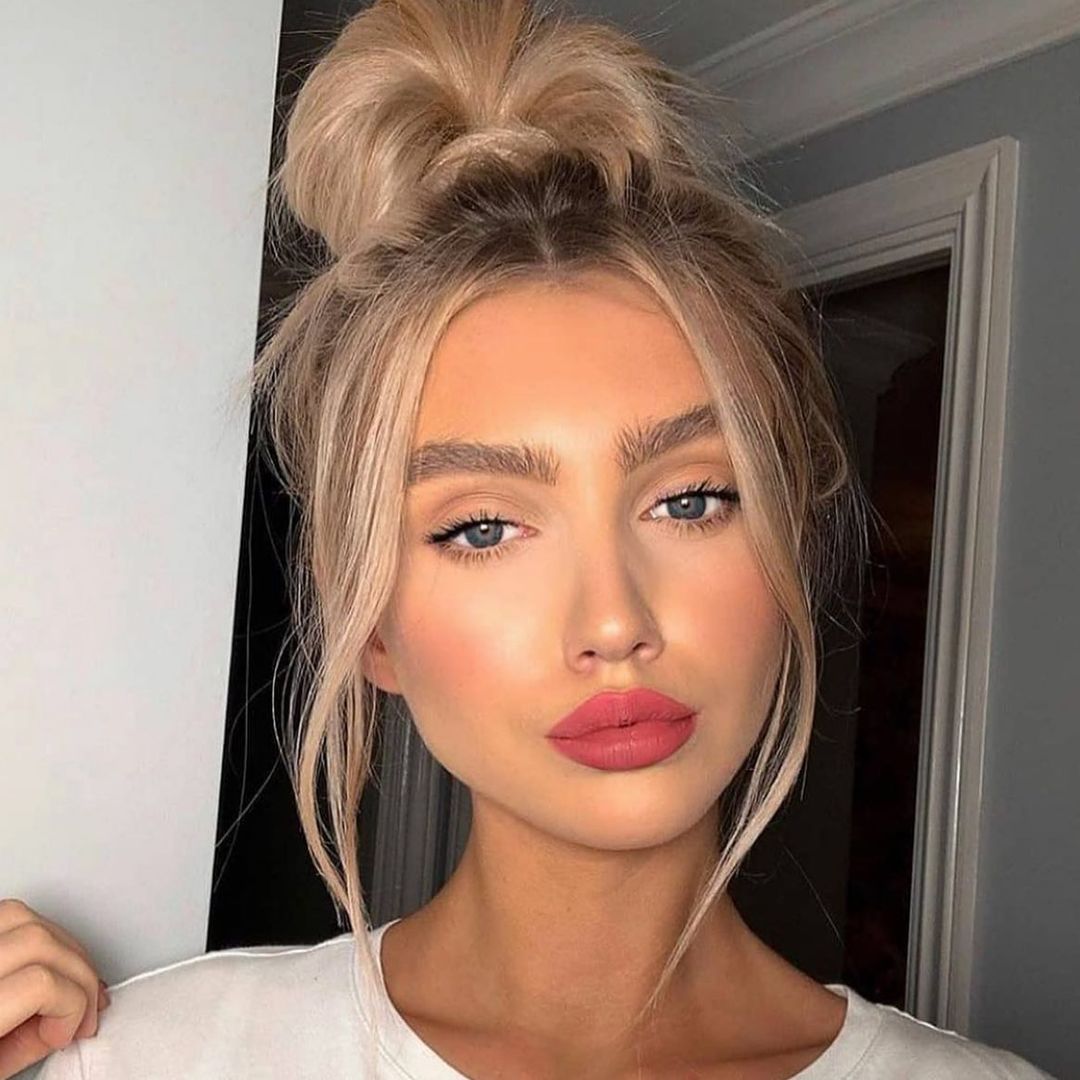 top bun with face-framing layers