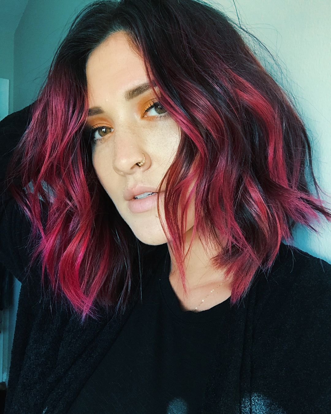 wavy short bob with red highlights