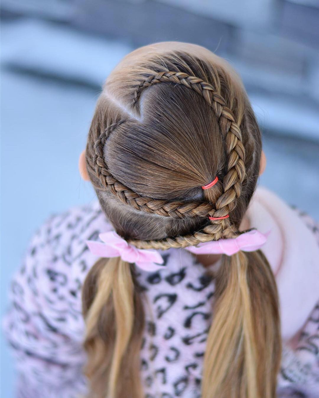 braided heart hairstyle with pigtails