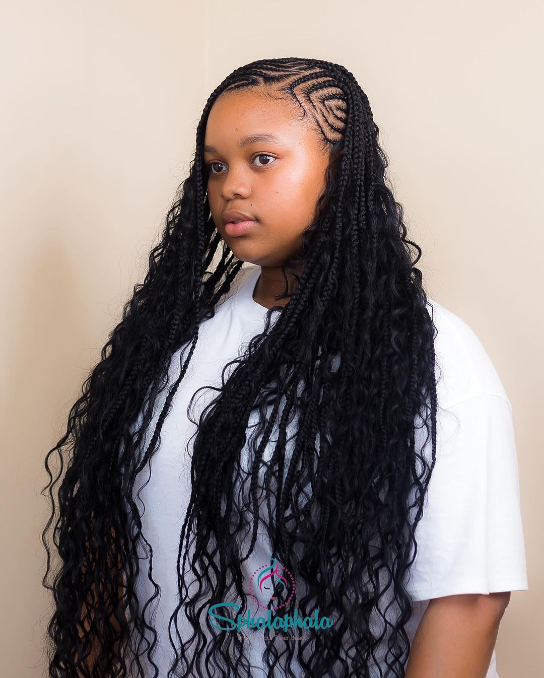 cornrows with ultra-long black curly weave