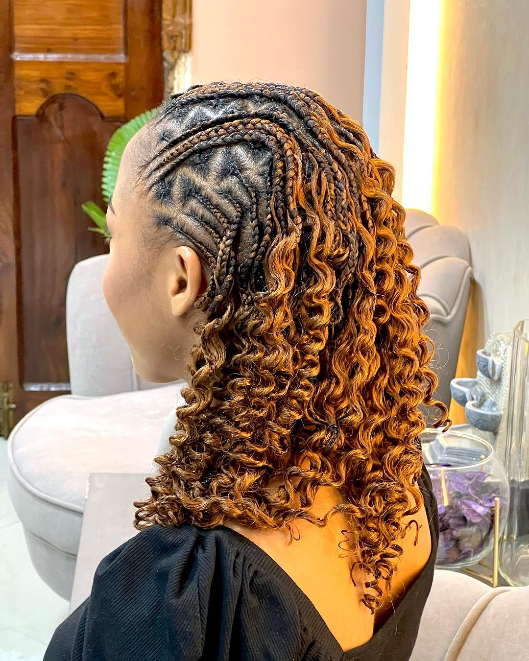 cornrows with zig zag parting and curls at the back