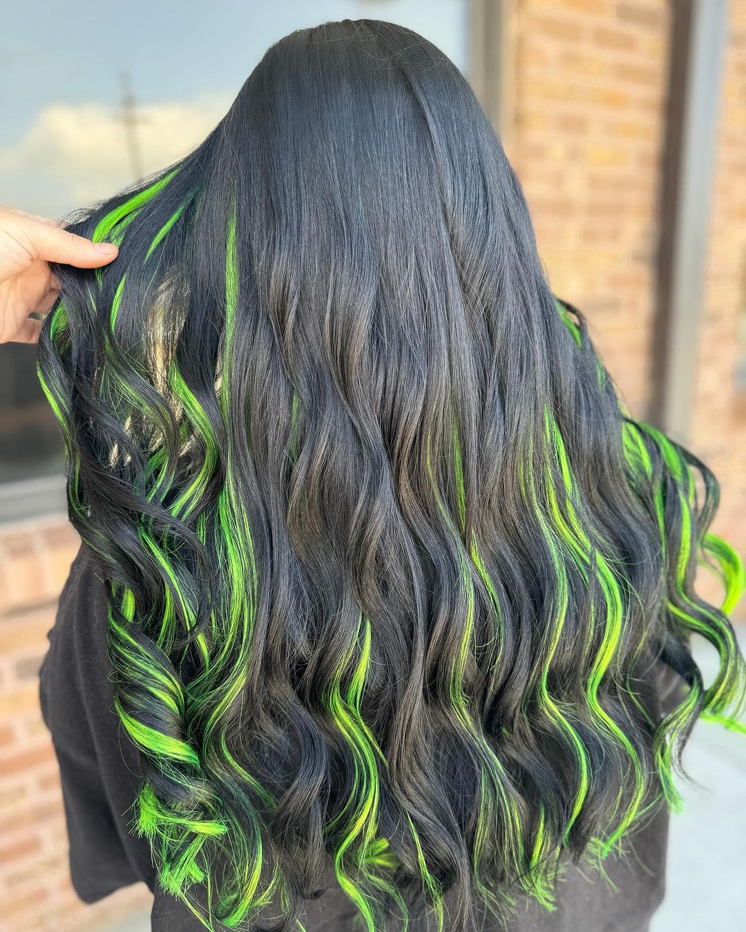 dark hair with green highlights