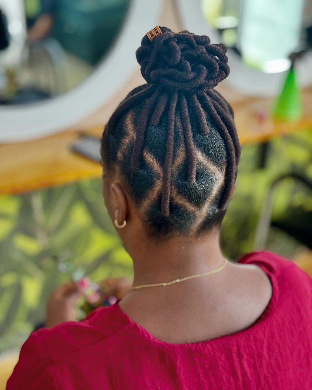 diamond parted flat twist locs petal bun