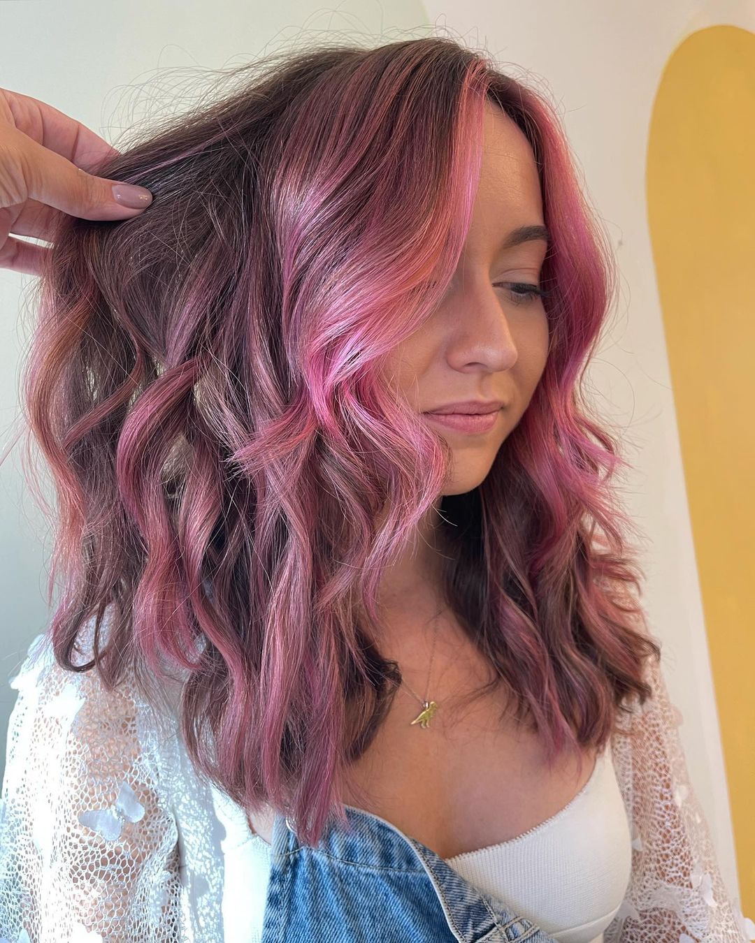 face-framing pastel pink highlights