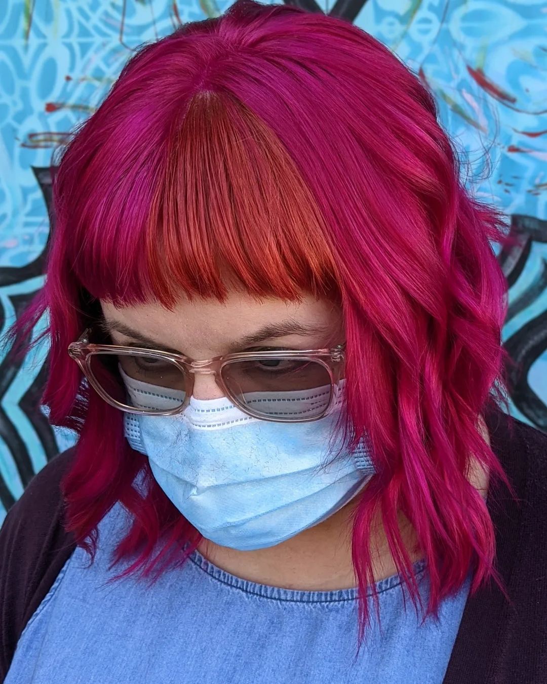 fuschia wavy hair with color block copper bangs