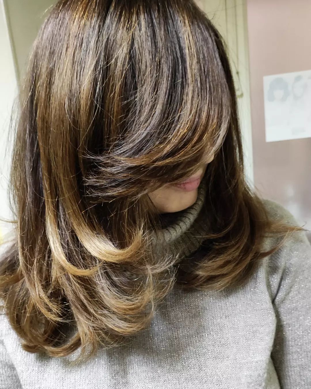 kitty cut with honey blonde highlights