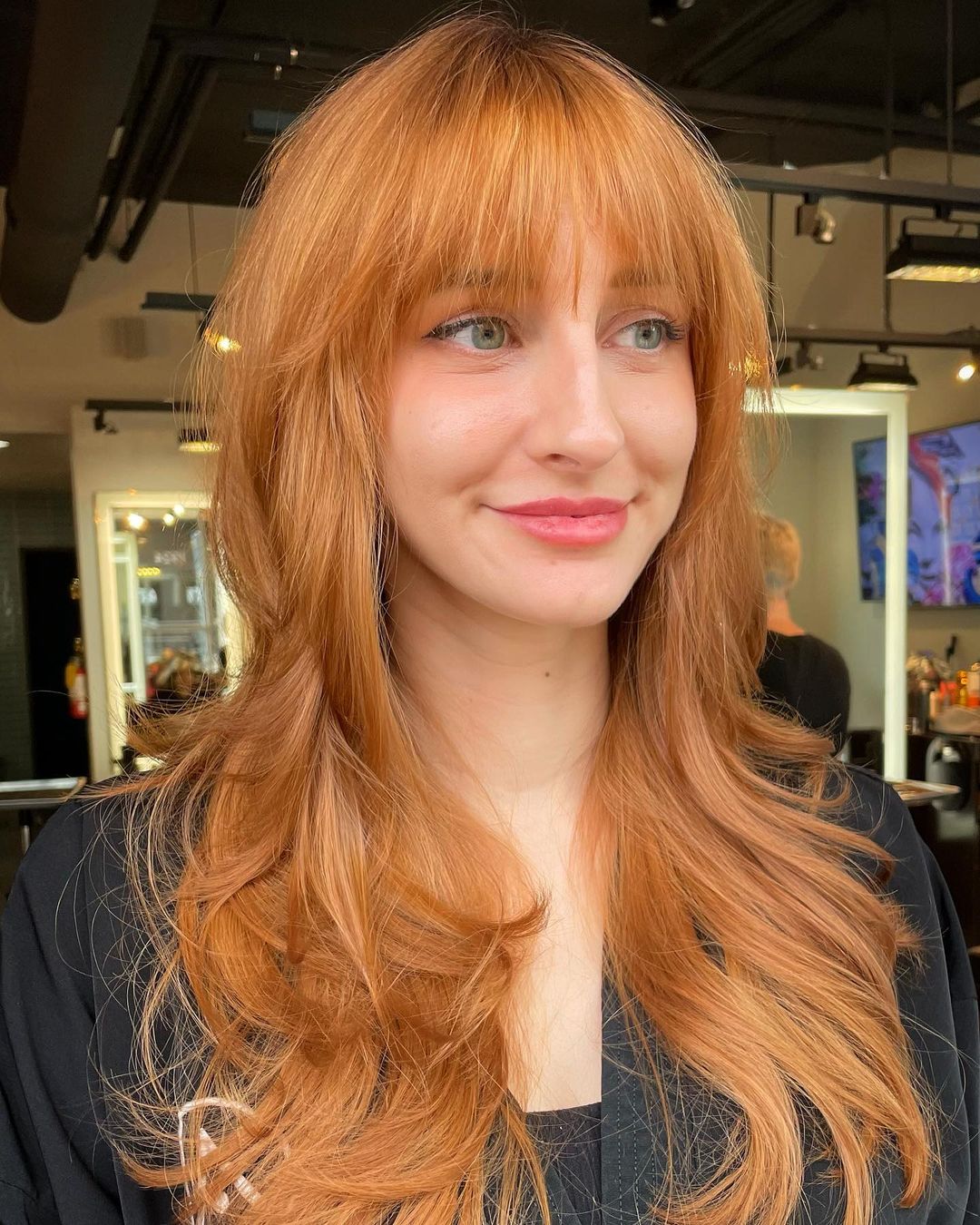 light copper layered hair with bangs