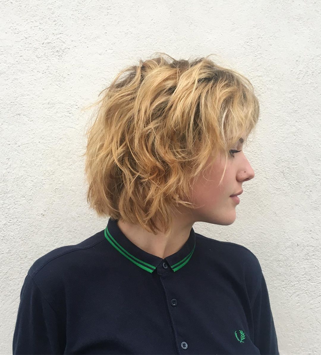 messy strawberry blonde bob