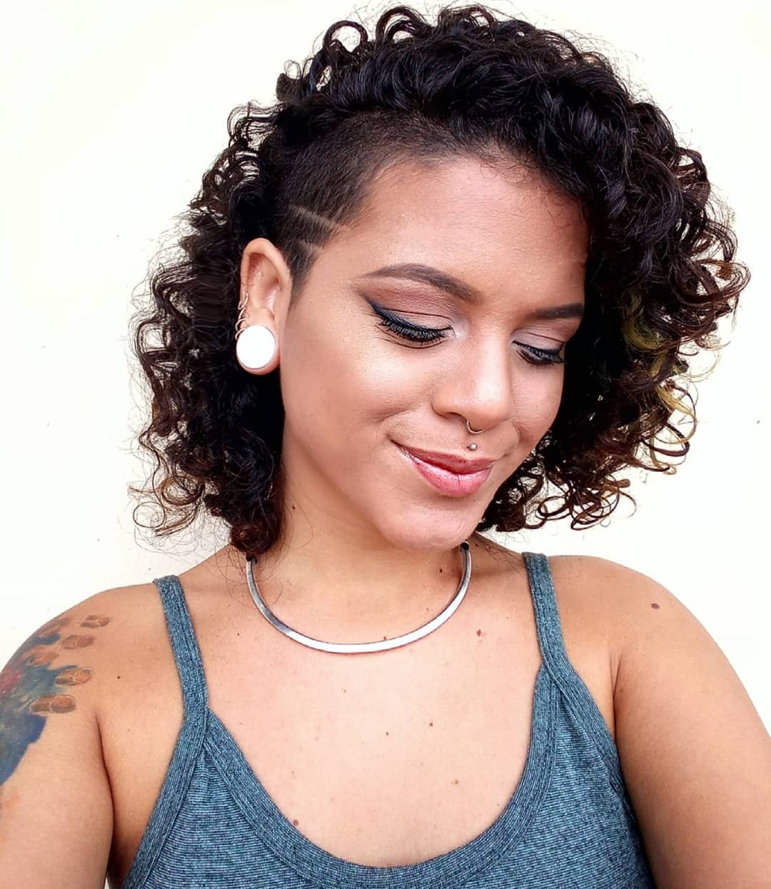 short curly bob with a side undercut