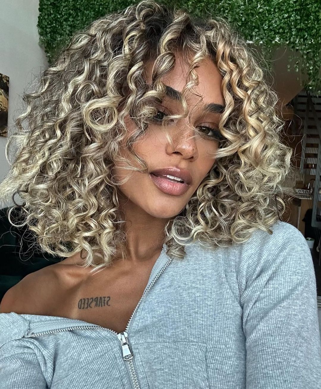 short curly hair with blonde highlights