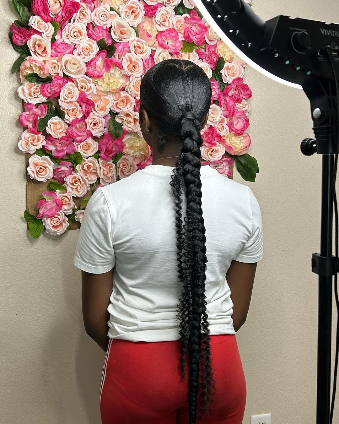 sleek braided ponytail with a heart shape detail in hair