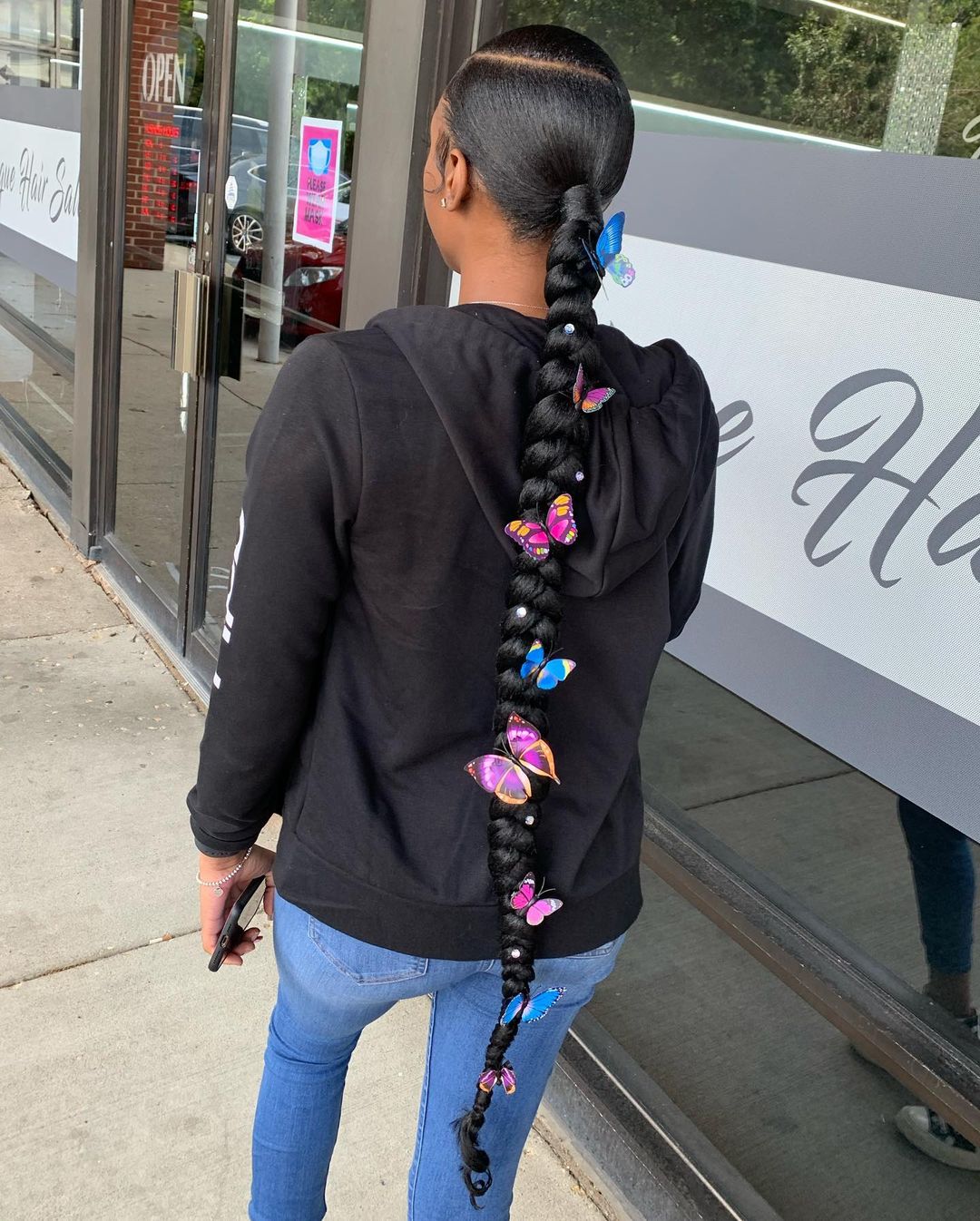 sleek braided ponytail with butterfly clips