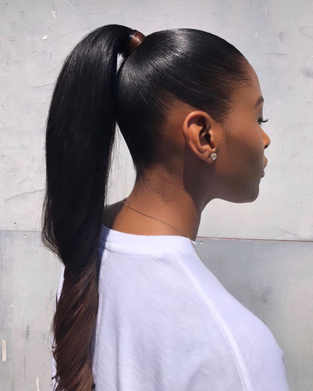 sleek high ponytail with twisted ends