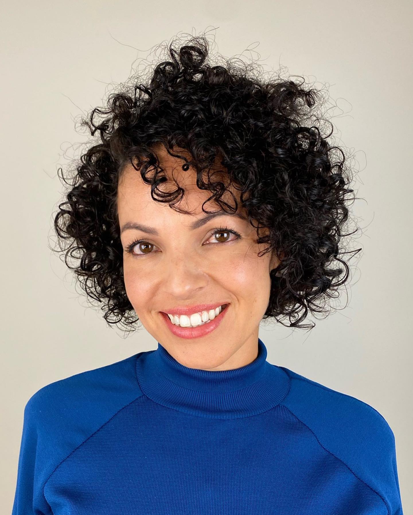 curly hair with wispy bangs