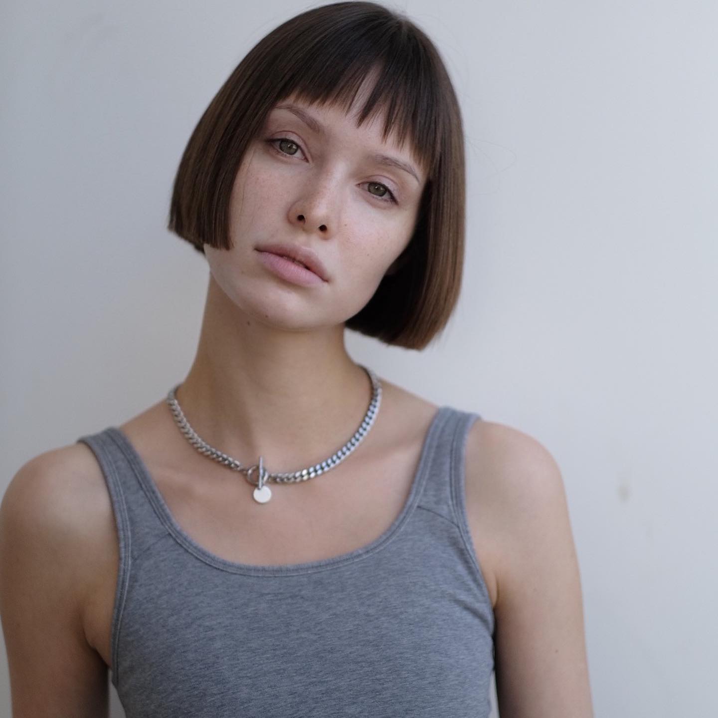 chin-length bob with wispy bangs