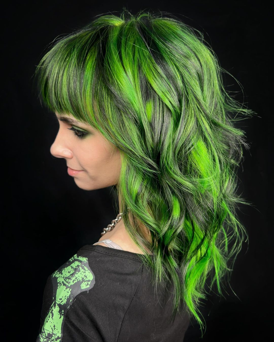 black hair with green highlights