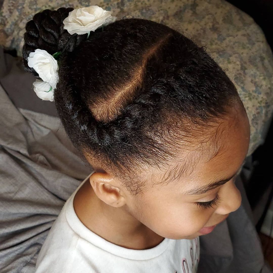 braided updo bun with flowers