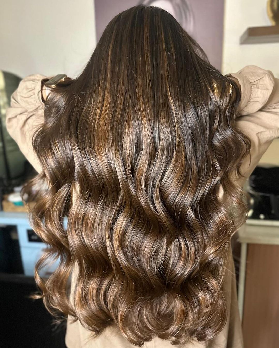 caramel balayage with babylights on long wavy hair