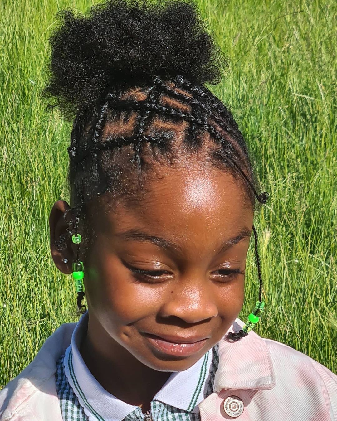 criss-cross cornrows with a high bun