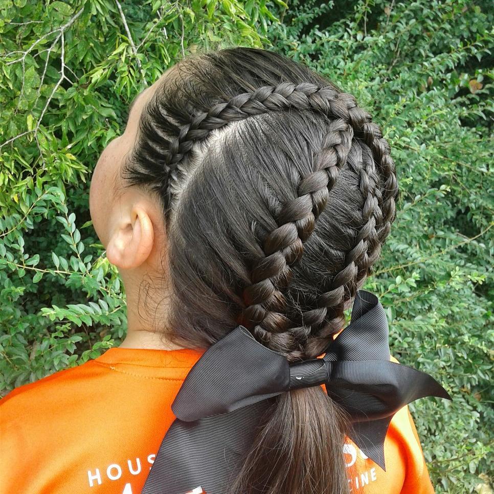 criss crossed lace Dutch braids with a middle 5-strand Dutch braid ponytail with a bow