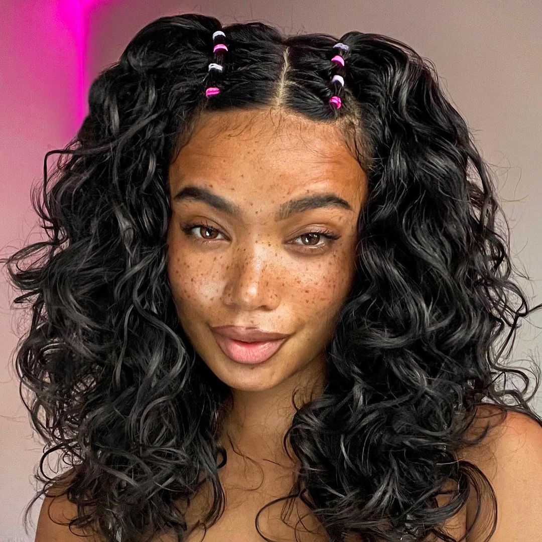 curls with two small bubble braids on the crown