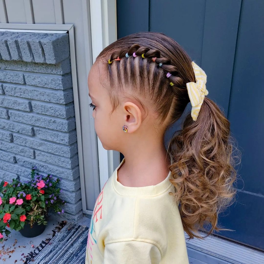 fun low ponytail with rainbow elastics