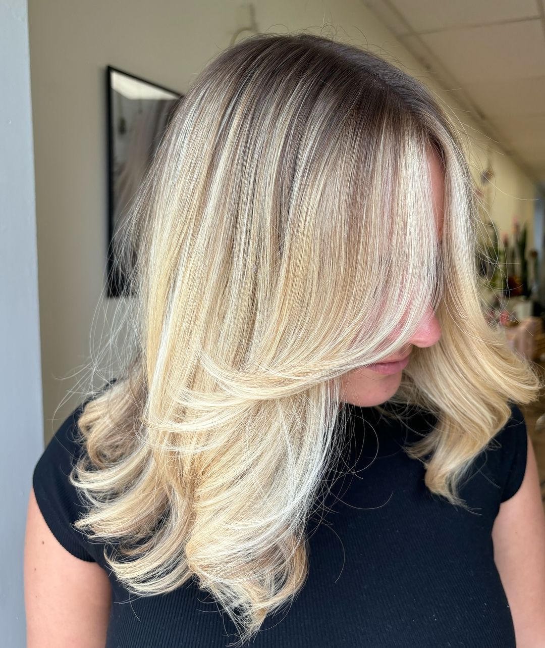 golden blonde hair with deep roots