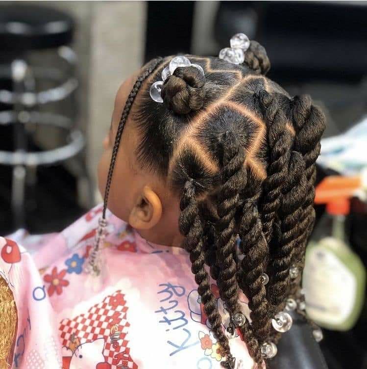 half-up space buns with twists