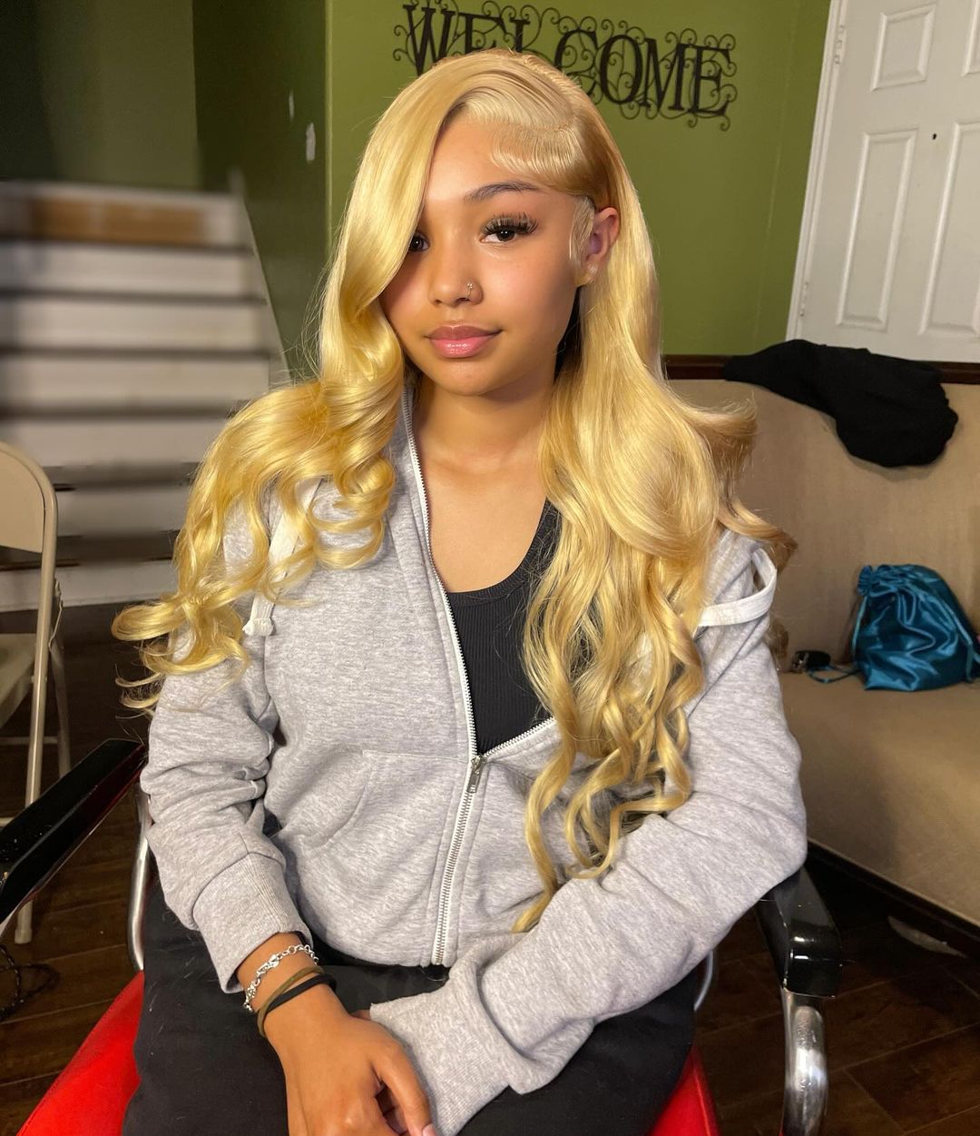 honey blonde glossed side part quick weave wavy hairstyle