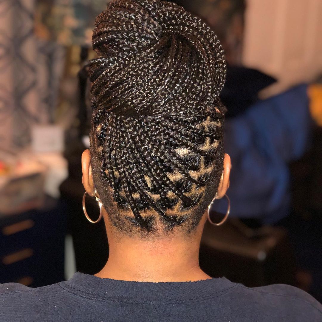 knotless braids with shaved sides top knot