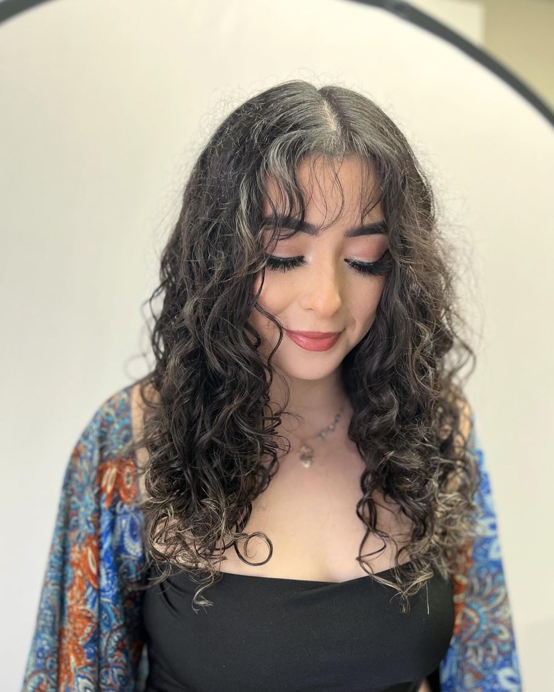 long curly layers with wispy bangs