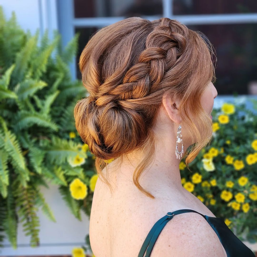 low bun with a side braid