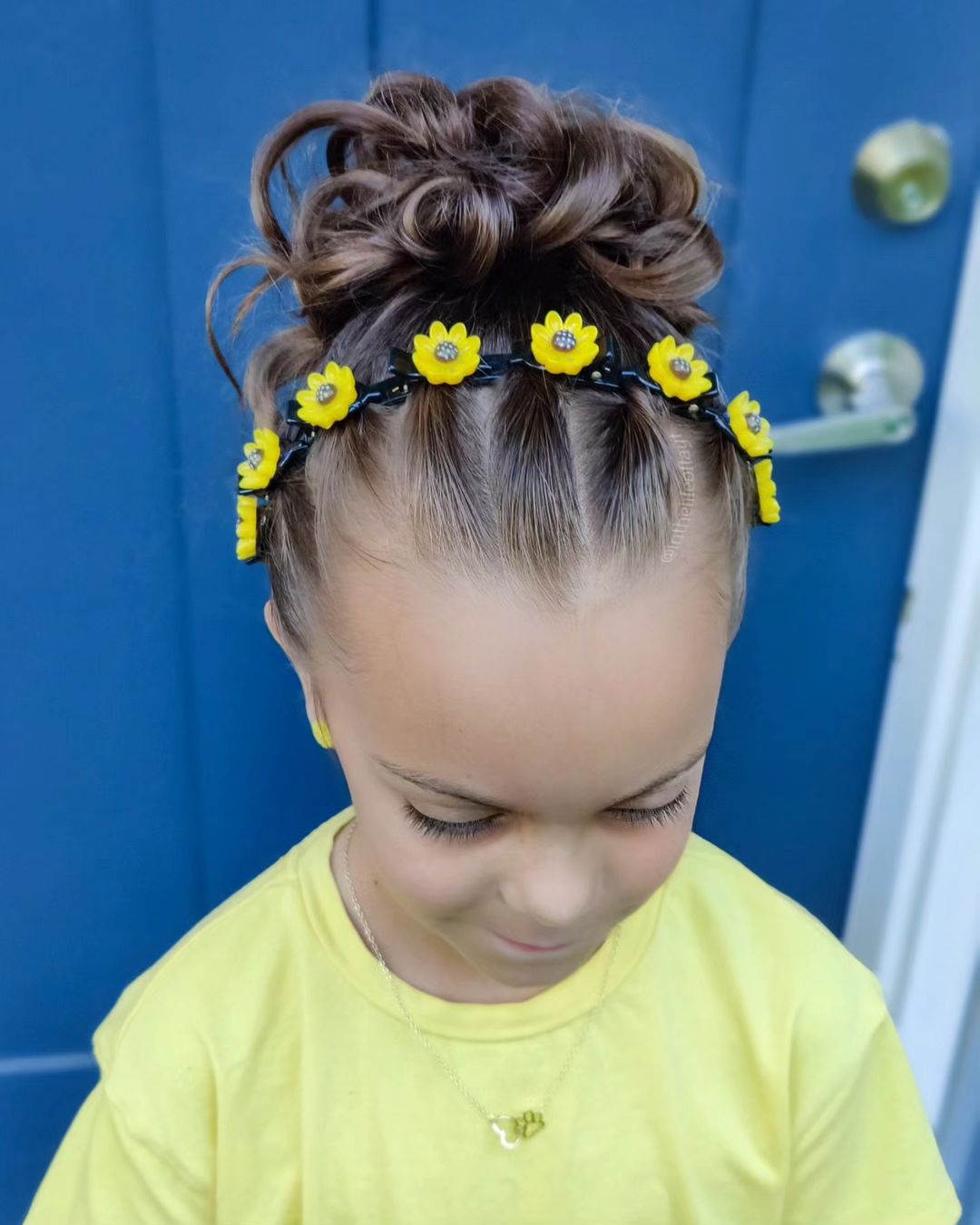 messy bun with a floral headband