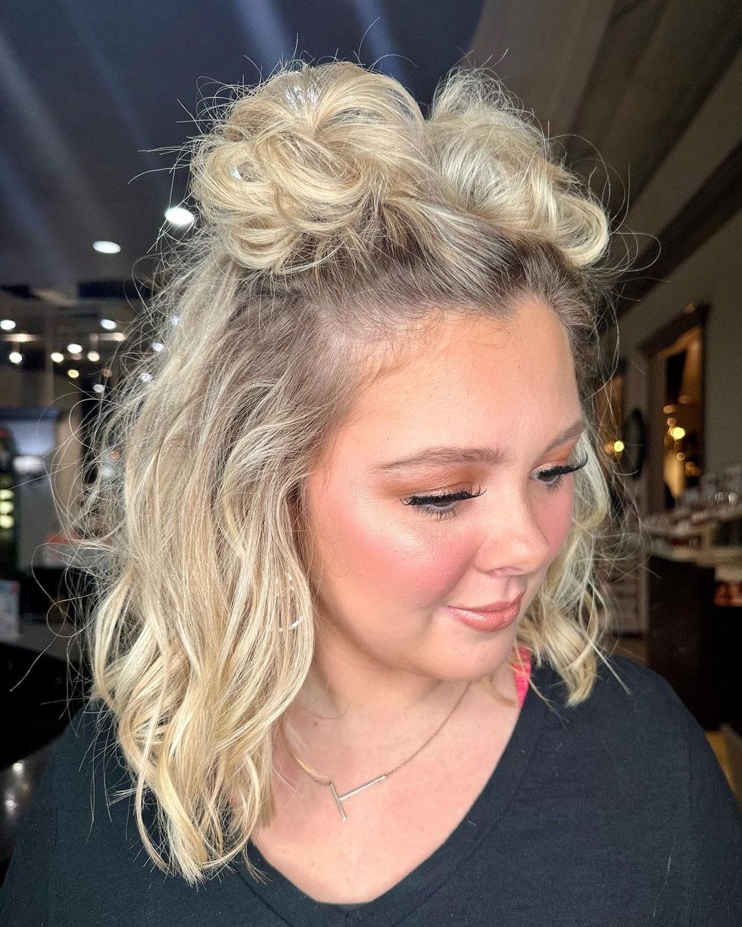 messy half-up space buns