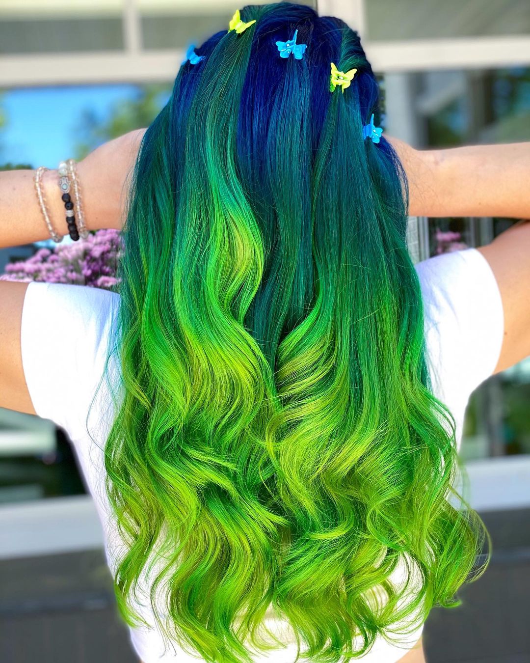 neon green + yellow + blue balayage with butterfly clips