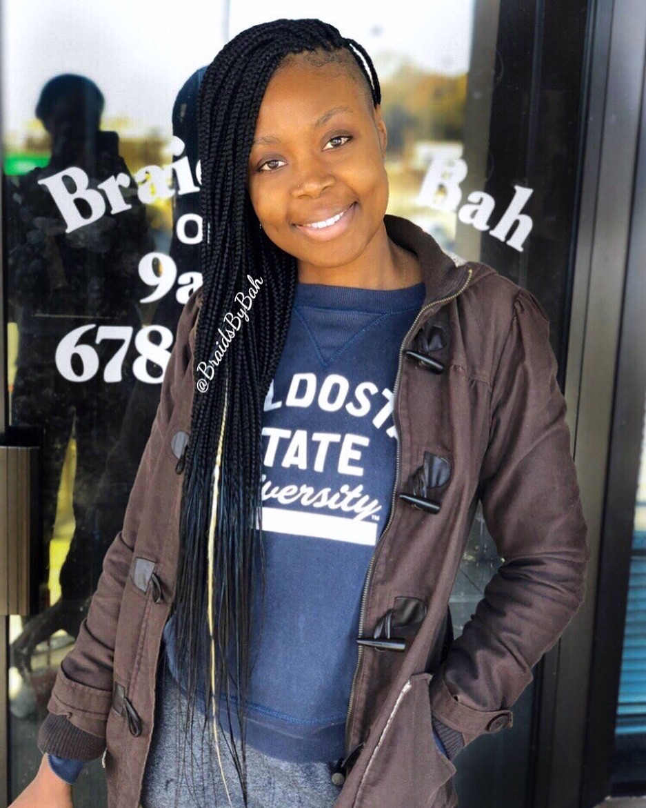 side parted box braids with shaved sides