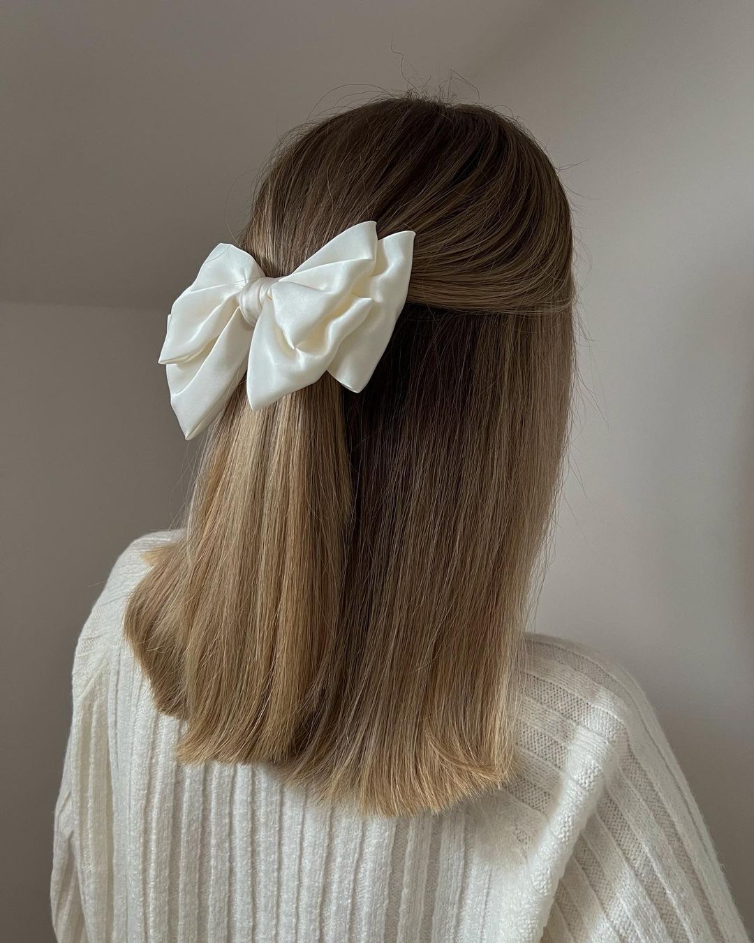 simple half updo with a bow