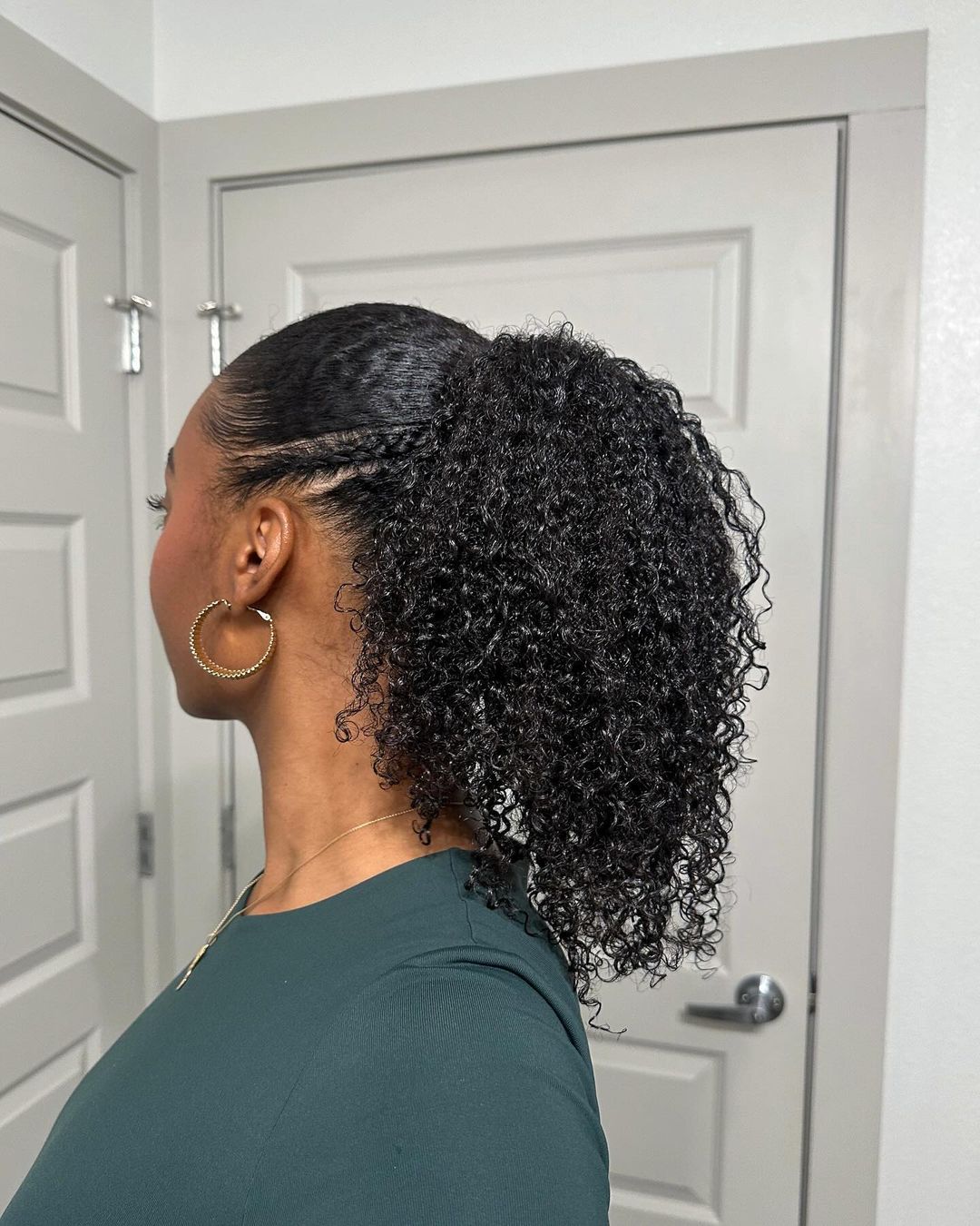 sleek curly ponytail