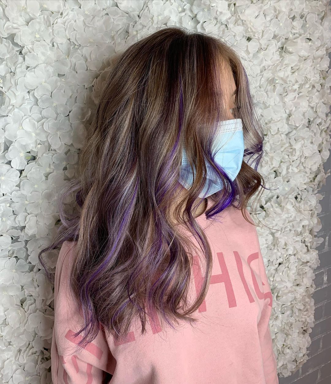 subtle purple highlights on brunette hair