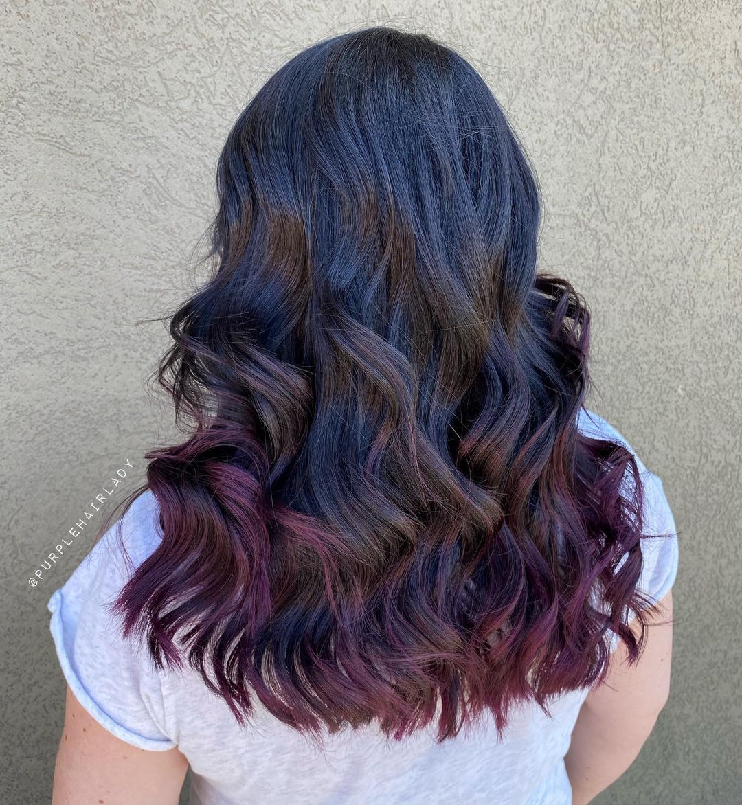 subtle purple red highlights on dark hair