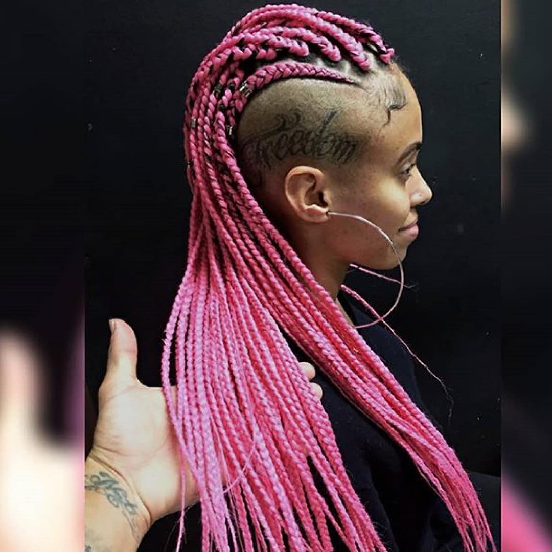 vivid pink braids with shaved tattoo design