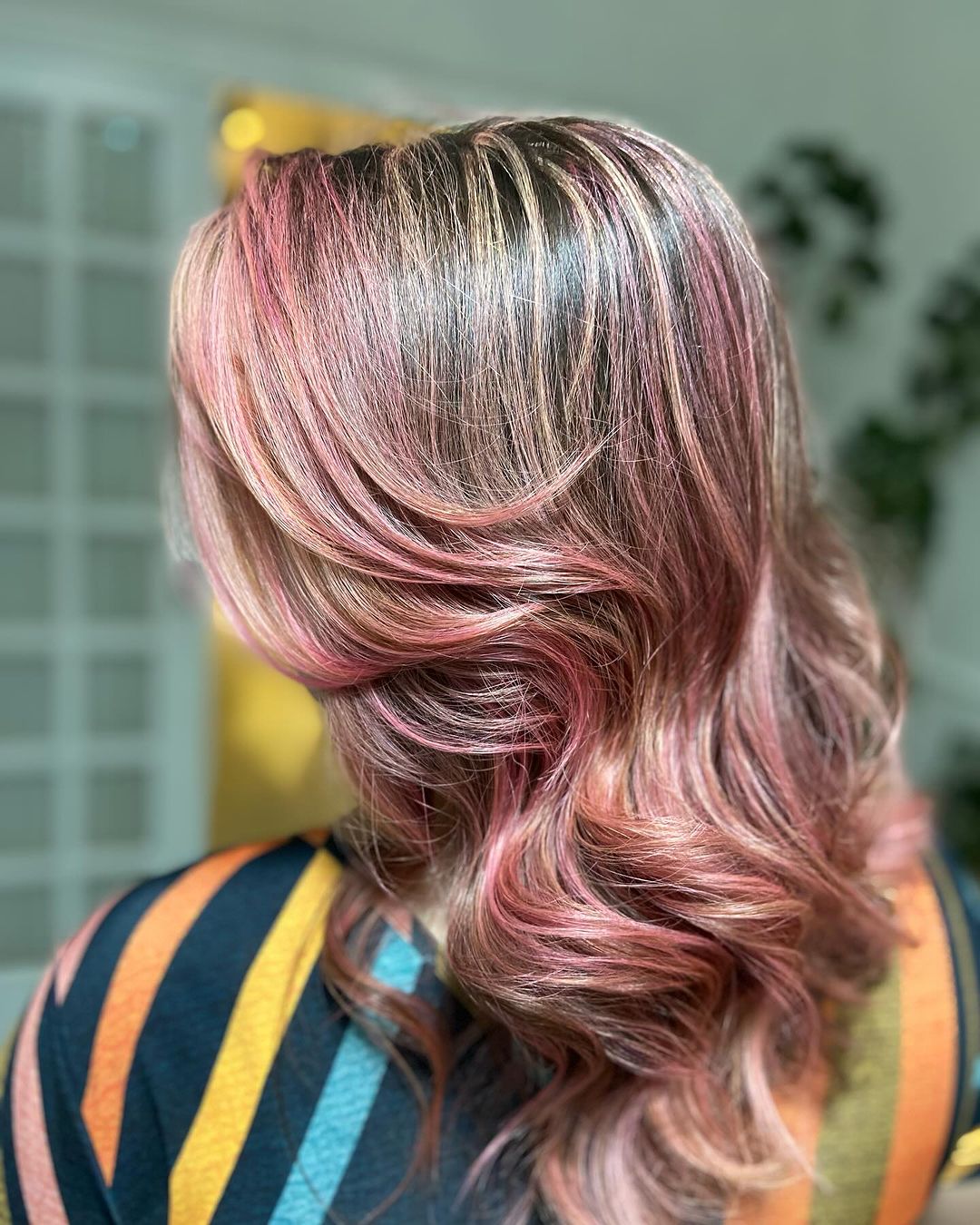 vivid rose gold highlights on brown hair