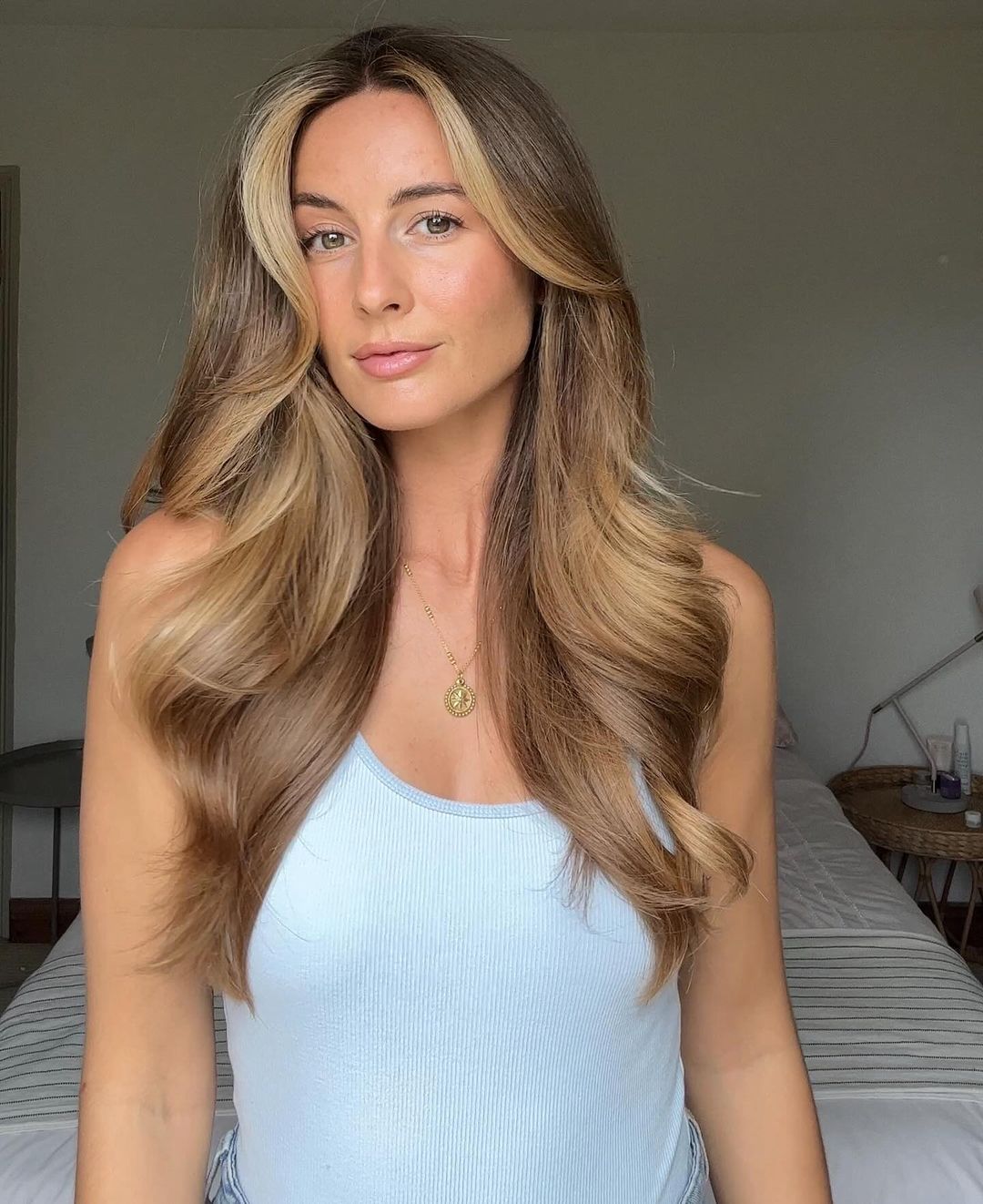 warm golden blonde hair with lighter face-framing highlights