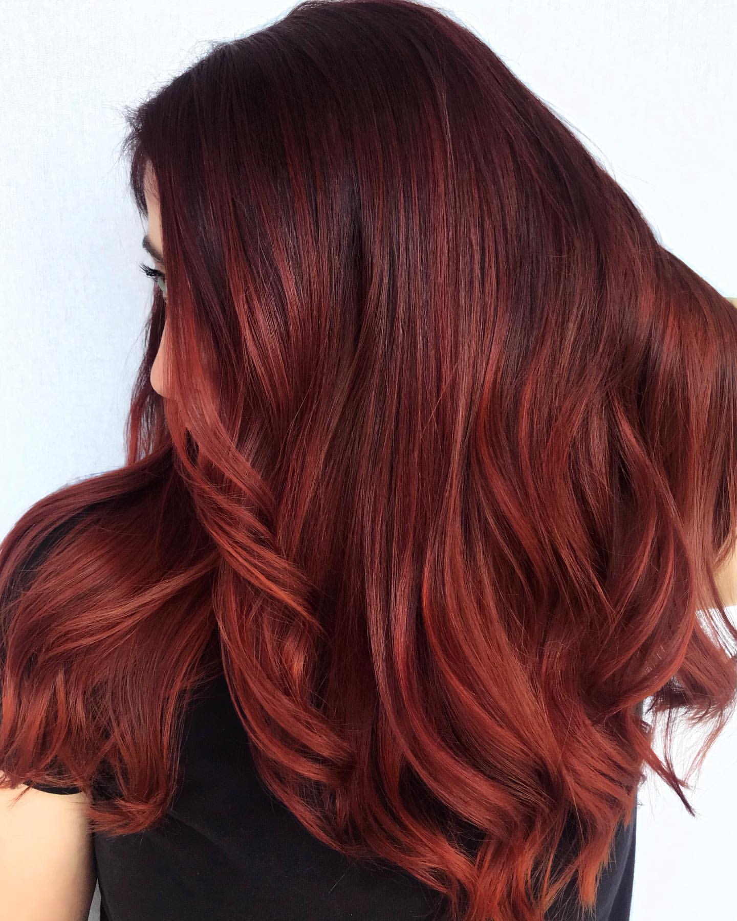 deep cherry red hair with highlights