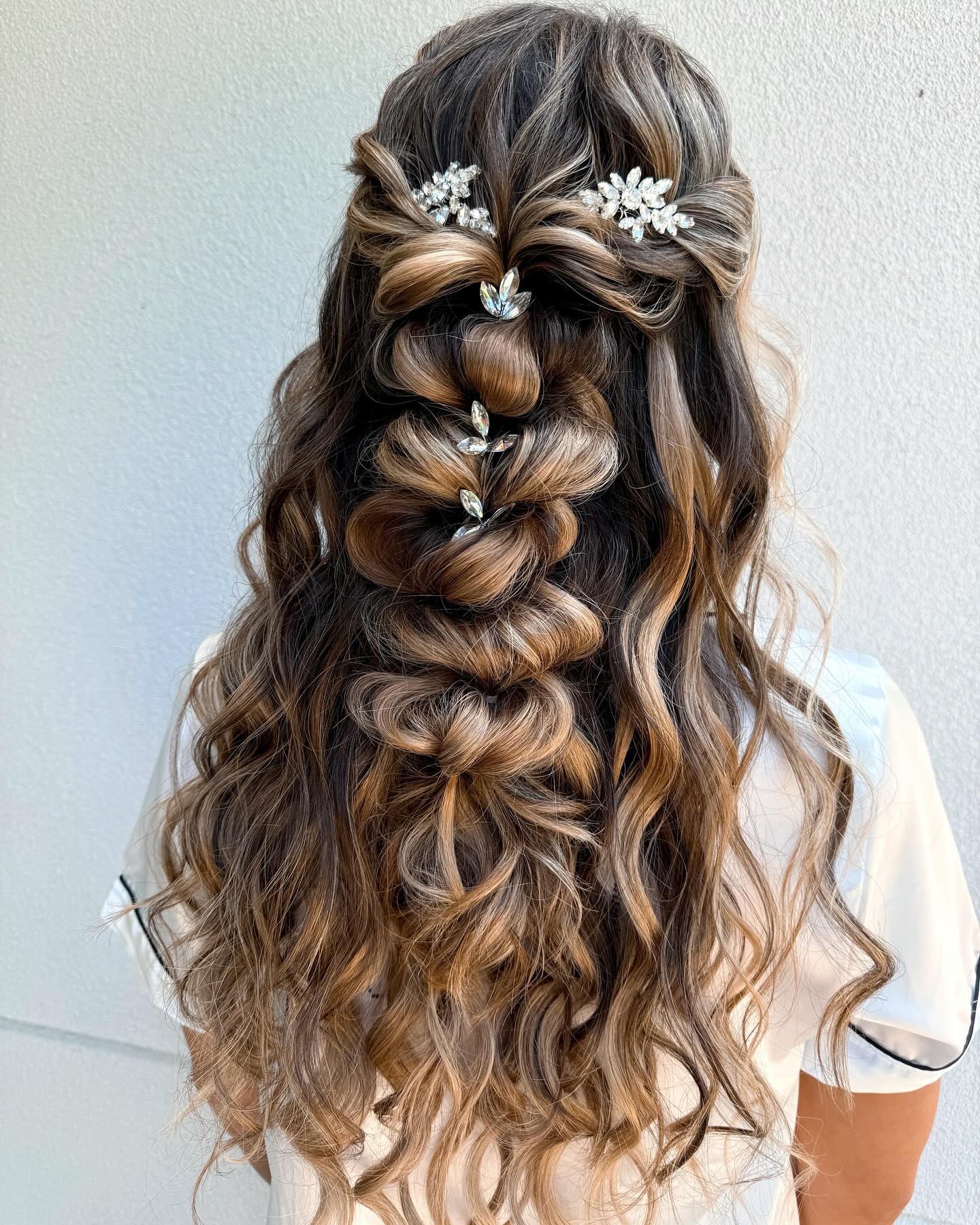 waterfall pull-through braid half-up style