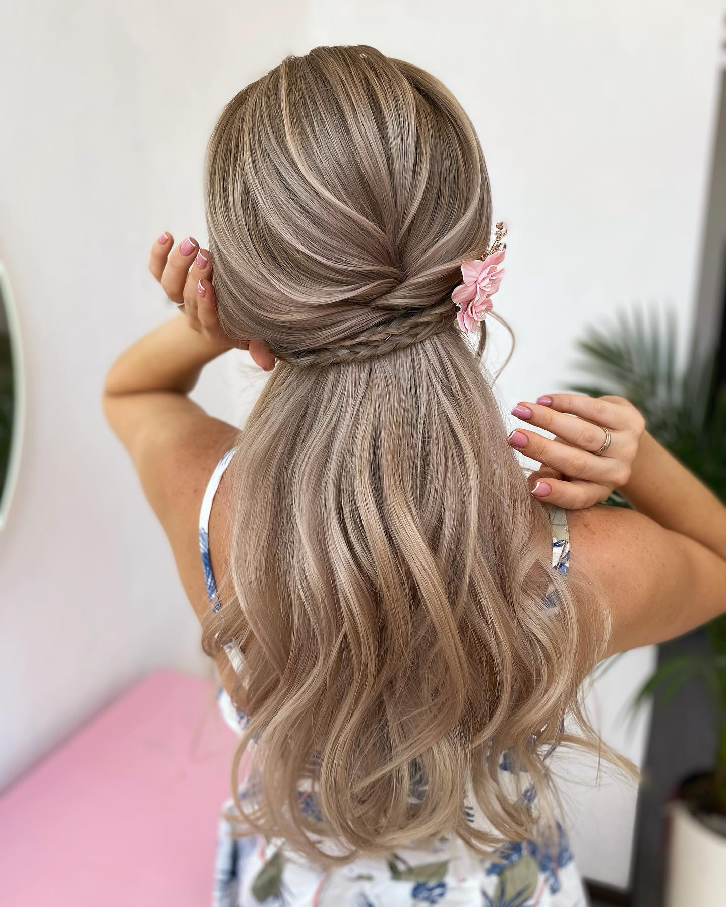 half-up bouffant with floral pin