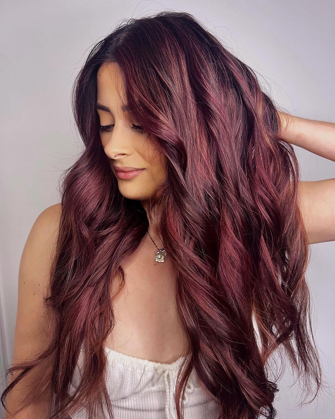 burgundy wine hair with rosy tones