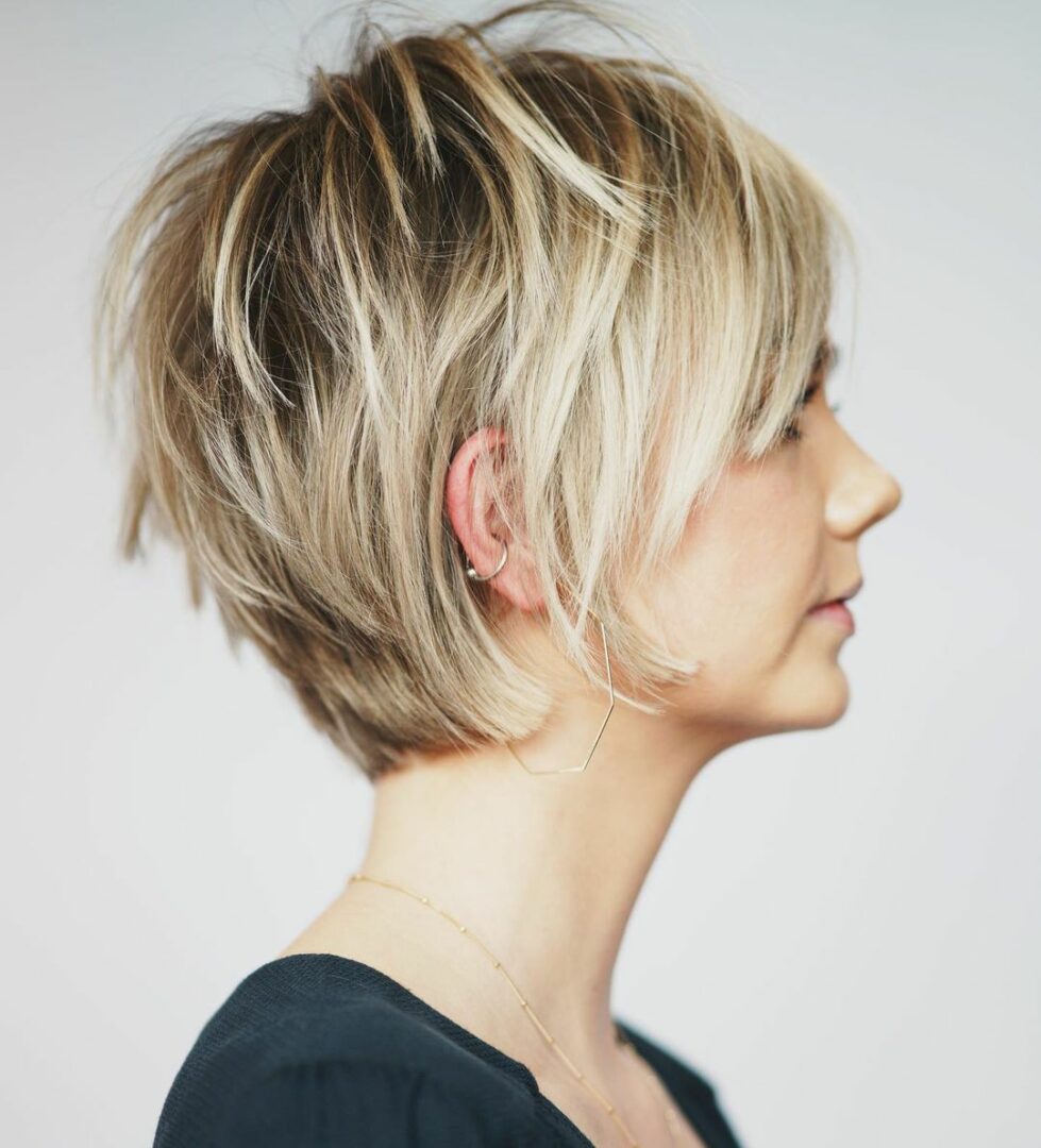 A modern long pixie cut, demonstrating how strategic texturizing balances volume and sleek lines.