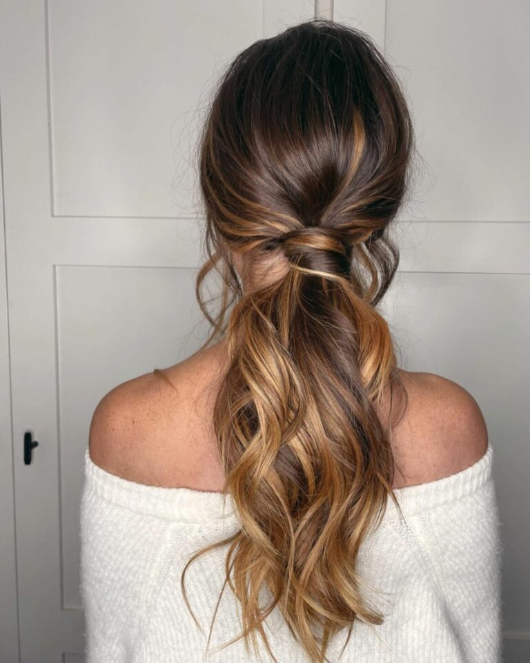 High ponytail with volume on a model with dark hair